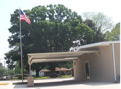 Side view of covered parking area and United States flag